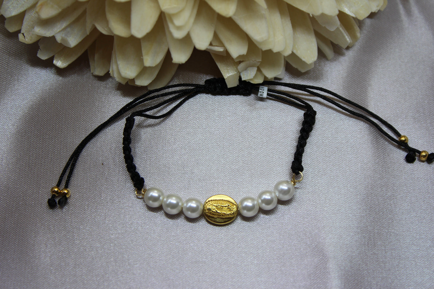 Pulsera tejida perlas V. Gpe