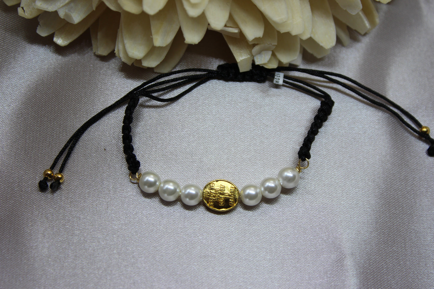 Pulsera tejida perlas V. Gpe